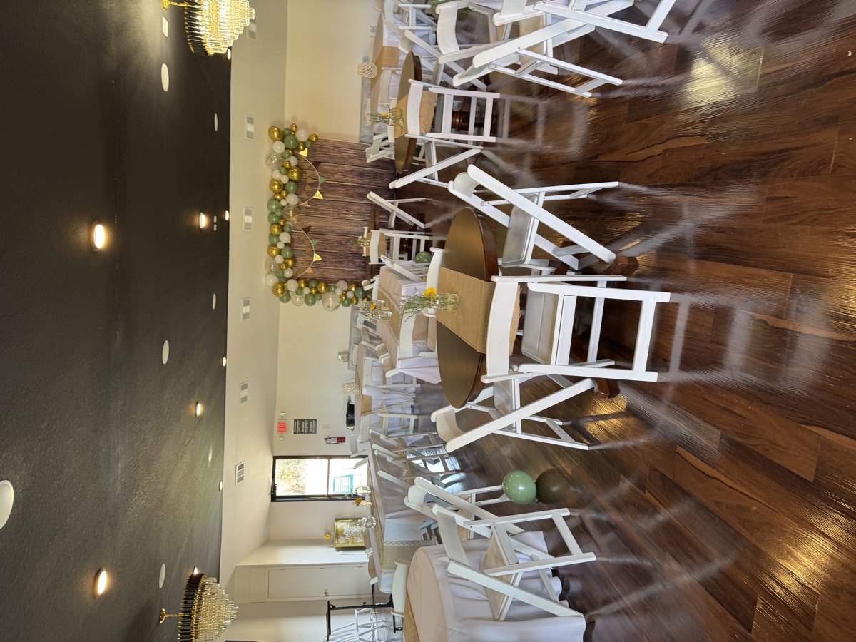 Shower-style celebration with sage and gold balloon arch