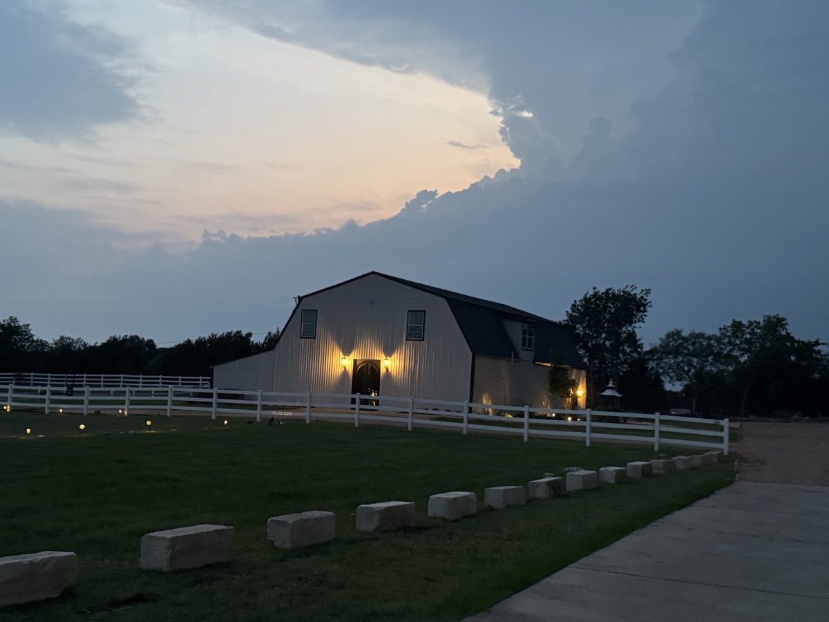 Venue at twilight under a dramatic sky