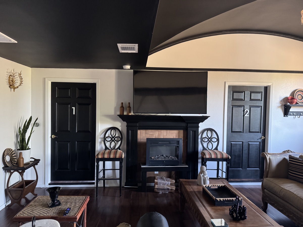 Lounge with numbered doors and fireplace