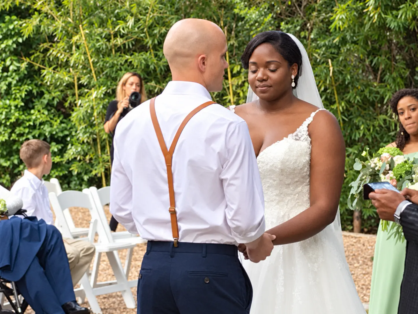 Couple sharing their vows in an intimate outdoor ceremony