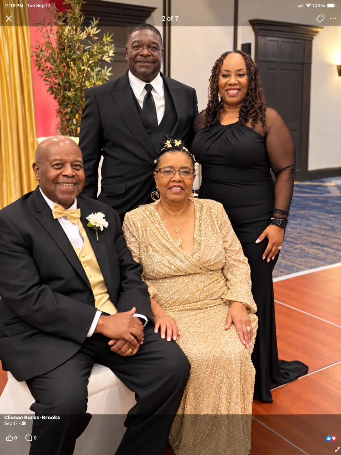 Rosemary and Phil Burkes seated with family at their golden anniversary